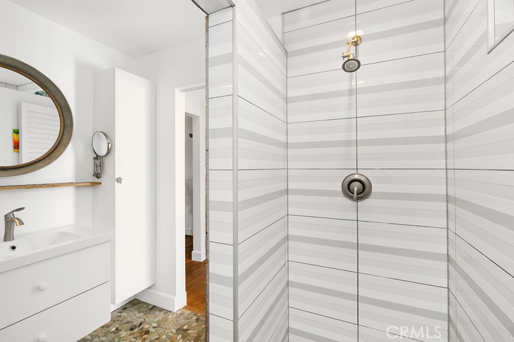 24272 Selva Road Dana Point, CA 92629 - Photo 26 of 39 a bathroom with a sink a toilet and shower