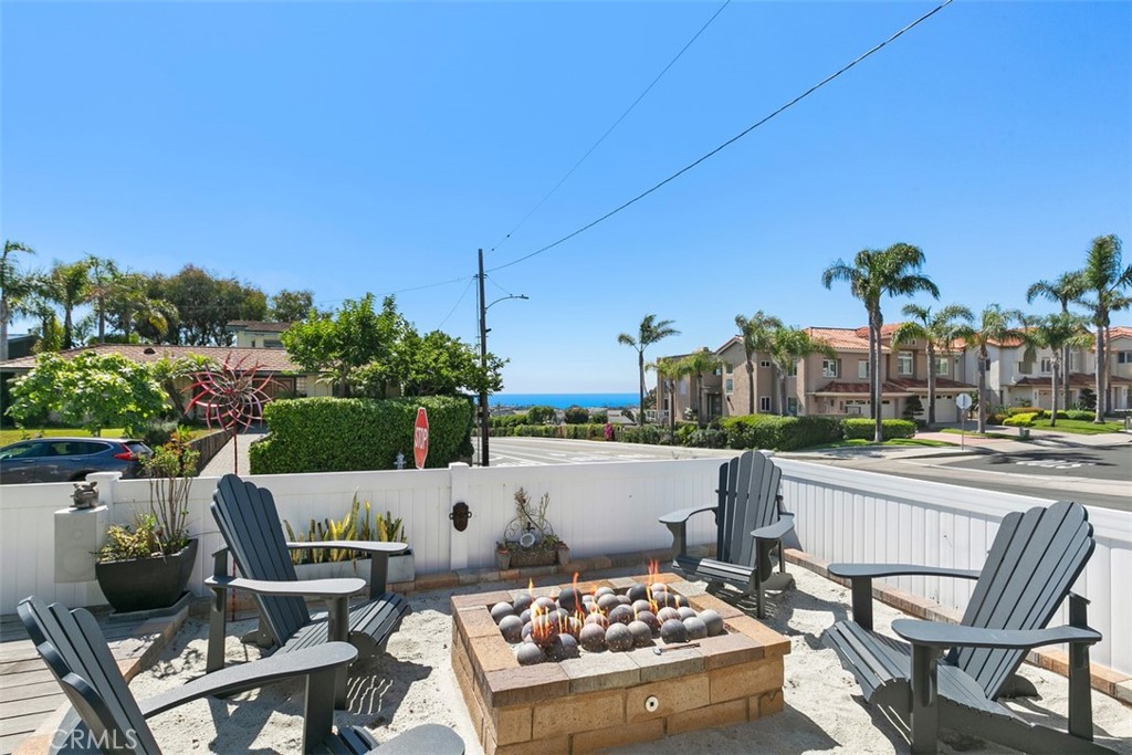 24272 Selva Road Dana Point, CA 92629 - Photo 6 of 39 a view of a terrace with furniture and stove