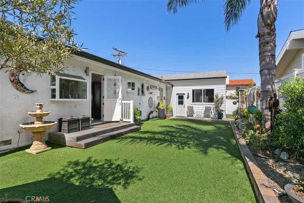 24272 Selva Road Dana Point, CA 92629 - Photo 10 of 39 a front view of a house with a garden and outdoor seating