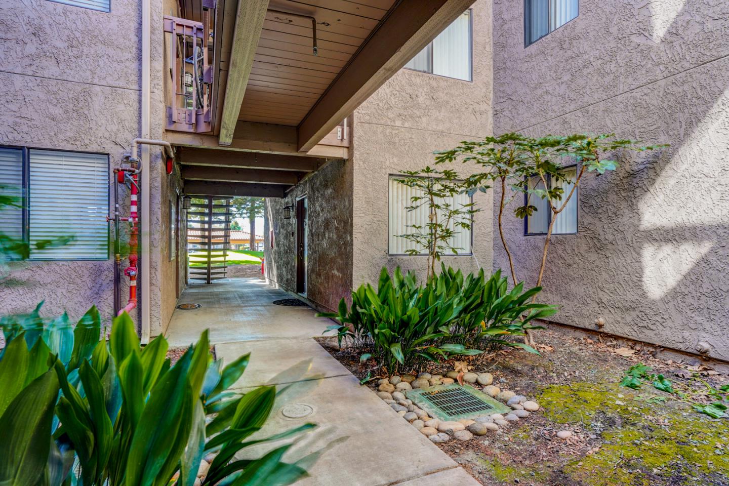 2250 Monroe Street, Unit 192 Santa Clara, CA 95050 - Photo 13 of 33 a front view of a house with a flower garden