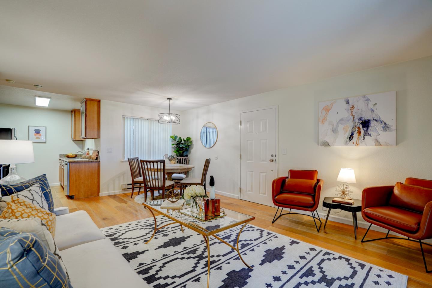 2250 Monroe Street, Unit 192 Santa Clara, CA 95050 - Photo 16 of 33 a living room with furniture a rug and a dining table with wooden floor