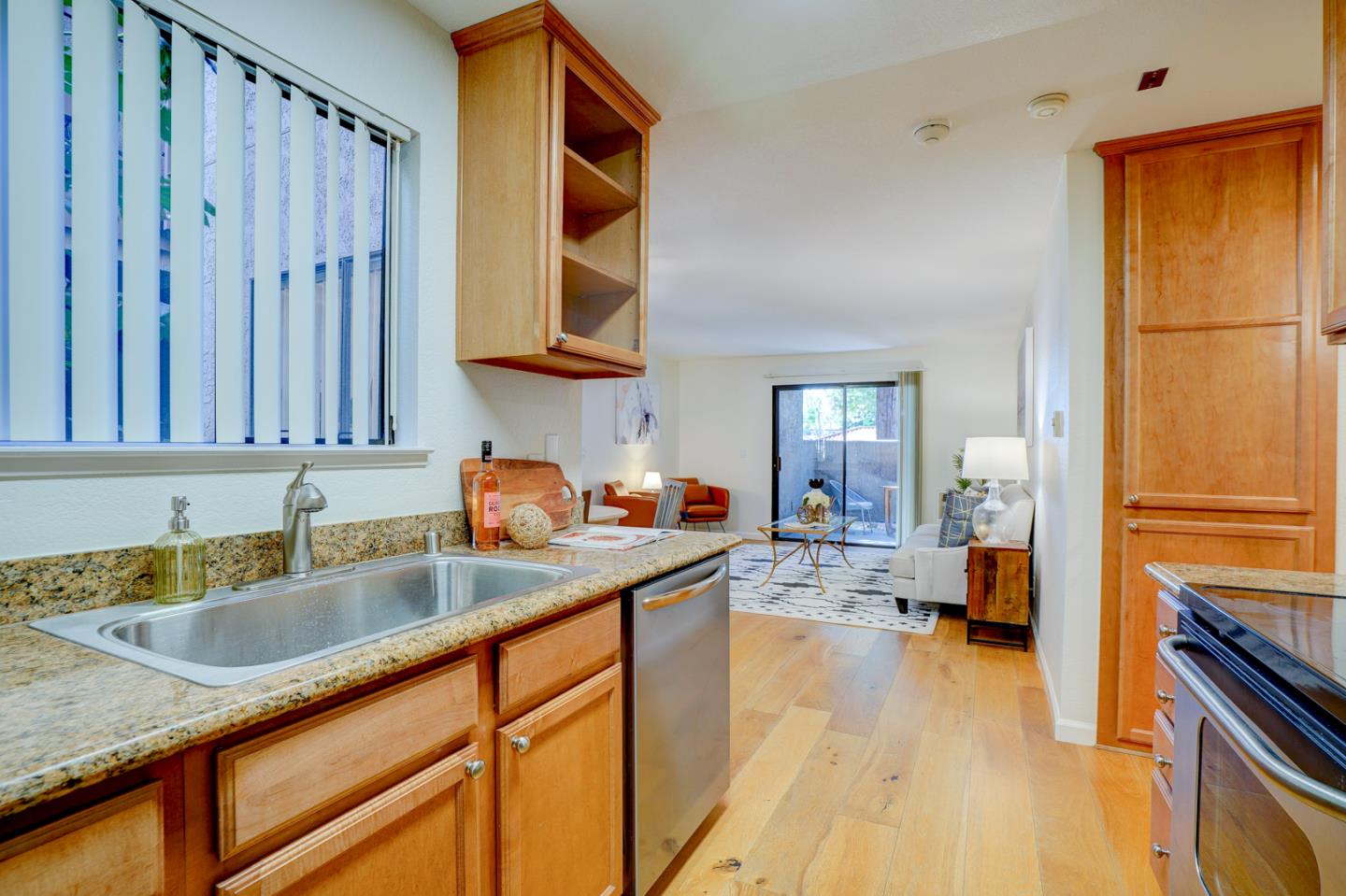 2250 Monroe Street, Unit 192 Santa Clara, CA 95050 - Photo 19 of 33 a kitchen with a sink and wooden cabinets