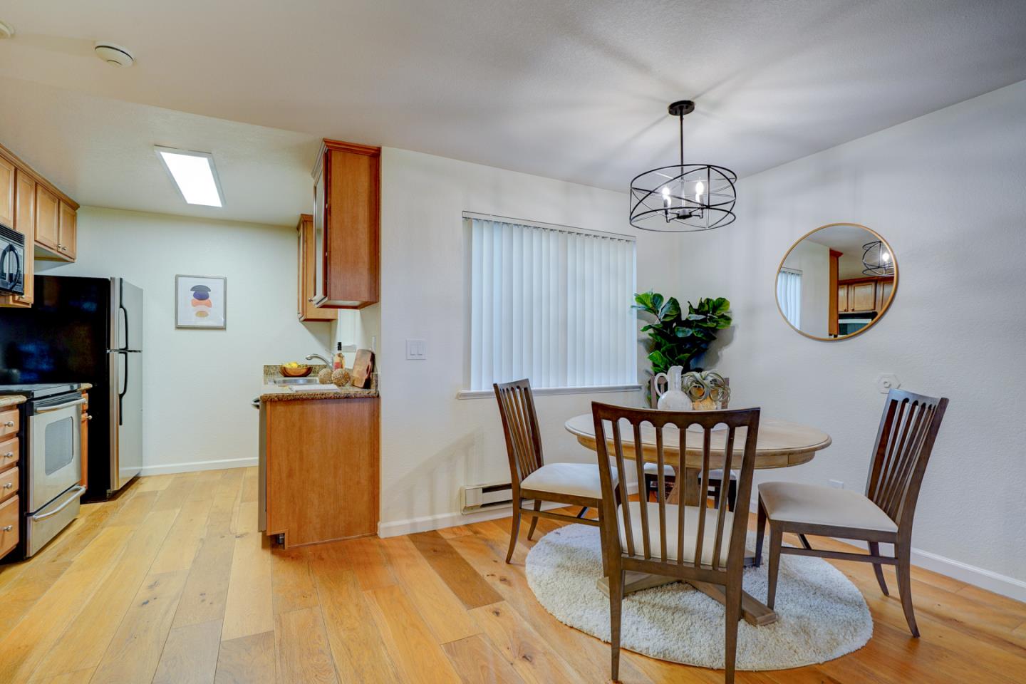 2250 Monroe Street, Unit 192 Santa Clara, CA 95050 - Photo 20 of 33 a dining room with furniture a chandelier and wooden floor