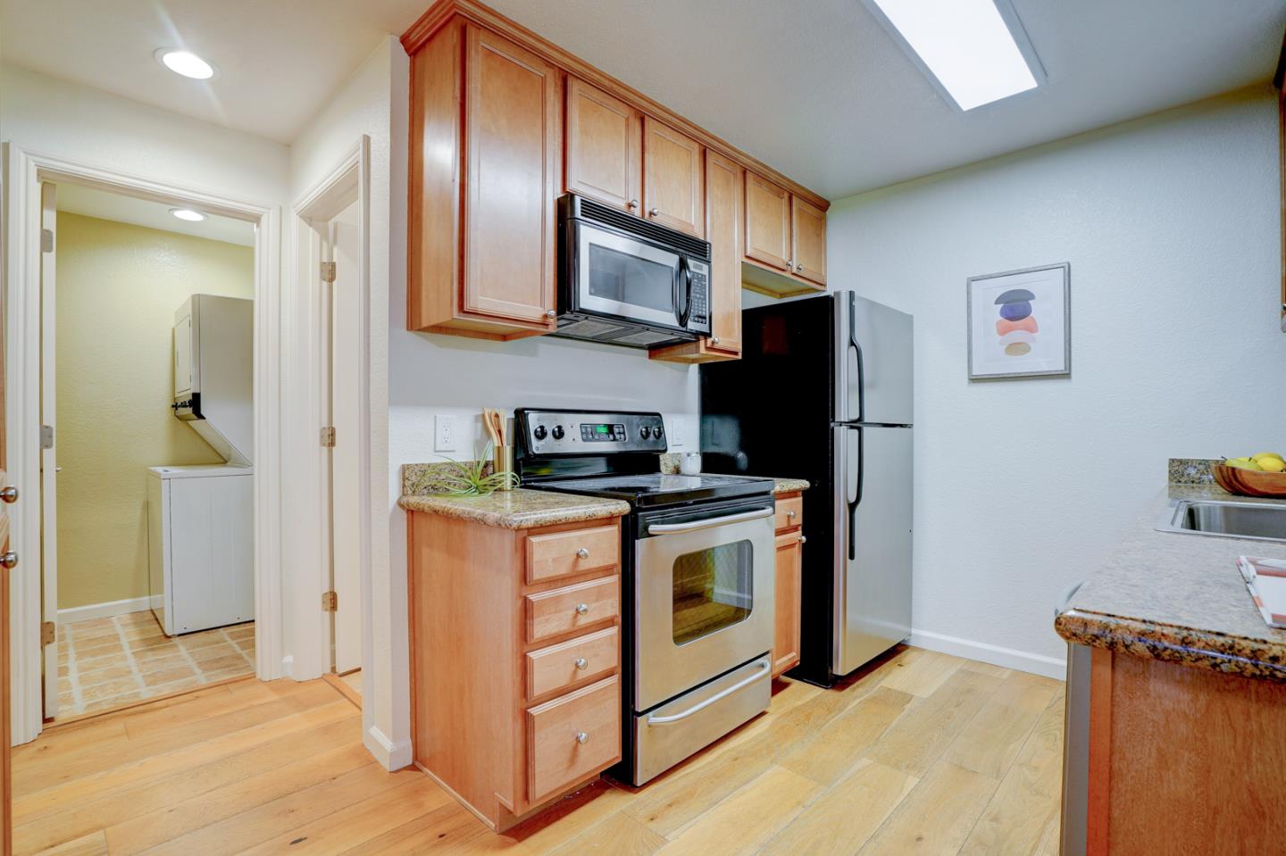 2250 Monroe Street, Unit 192 Santa Clara, CA 95050 - Photo 21 of 33 a kitchen with stainless steel appliances granite countertop a refrigerator stove and sink