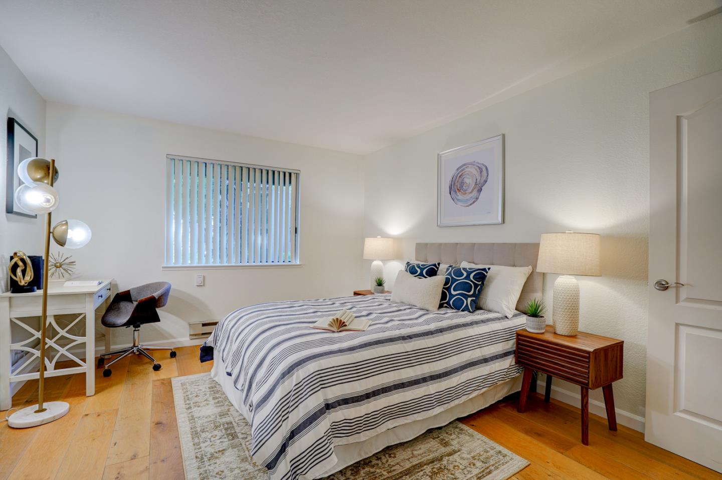 2250 Monroe Street, Unit 192 Santa Clara, CA 95050 - Photo 23 of 33 a bedroom with a bed and a lamp on table