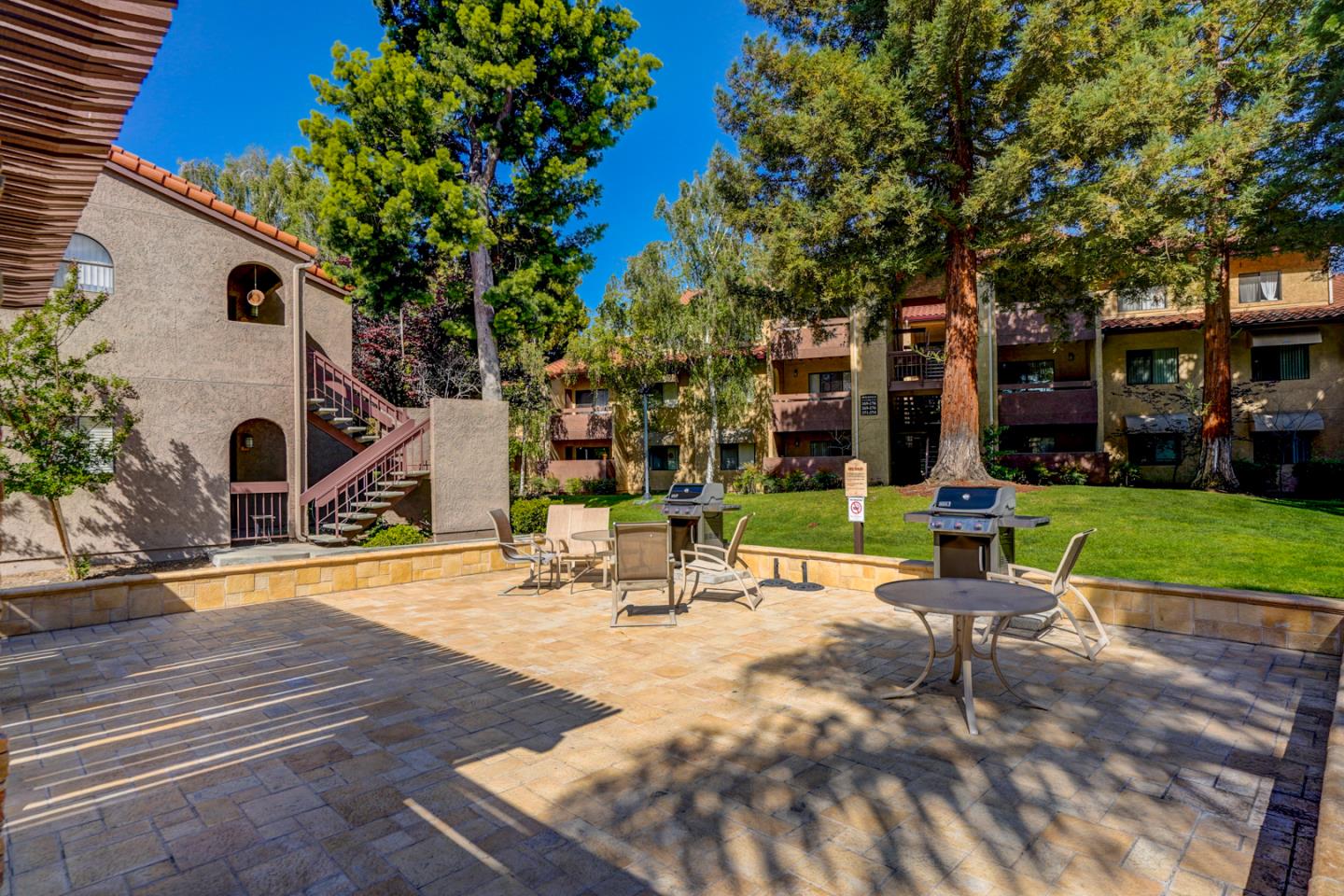 2250 Monroe Street, Unit 192 Santa Clara, CA 95050 - Photo 9 of 33 a view of a building with garden and tall trees