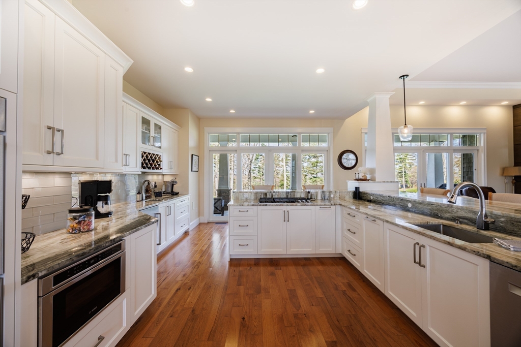 1776 Old Turnpike Road Oakham, MA 01068 - Photo 8 of 42 a large kitchen with stainless steel appliances granite countertop a lot of counter space and wooden floors