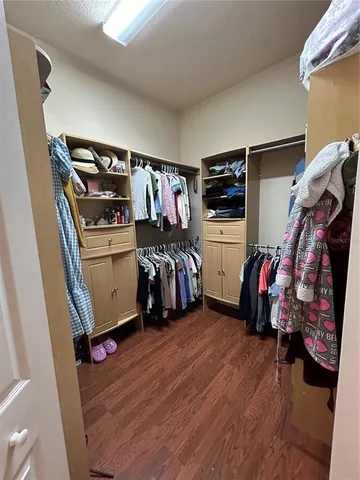 a bed room with a bed and a television