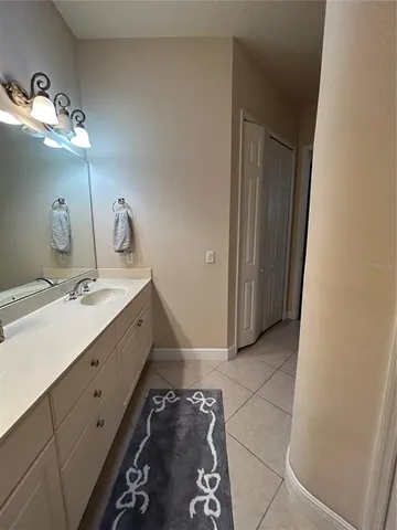 a bathroom with a double vanity sink and mirror