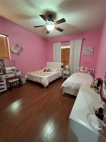 a bedroom with bed and window