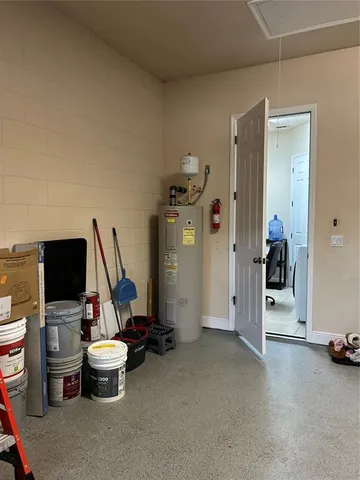 a room with gym equipment and a flat screen tv