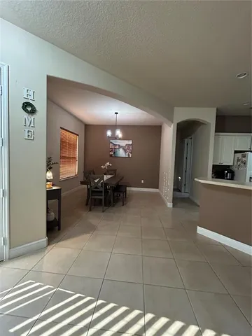 a lobby with furniture and a rug