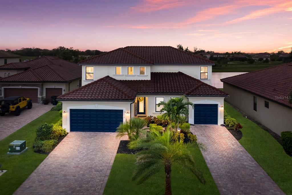 14410 Flat Woods Terrace Lakewood Ranch, FL 34211 - Photo 1 of 95 a front view of a house with a yard