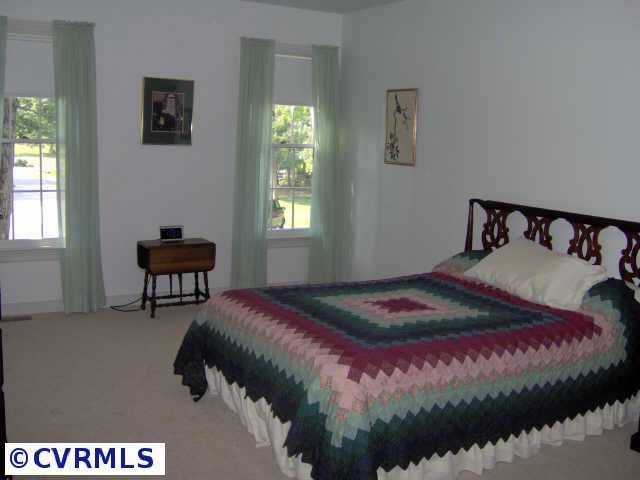 2612 Olde Stone Road Midlothian, VA 23113 - Photo 5 of 10 a bedroom with a bed and a window