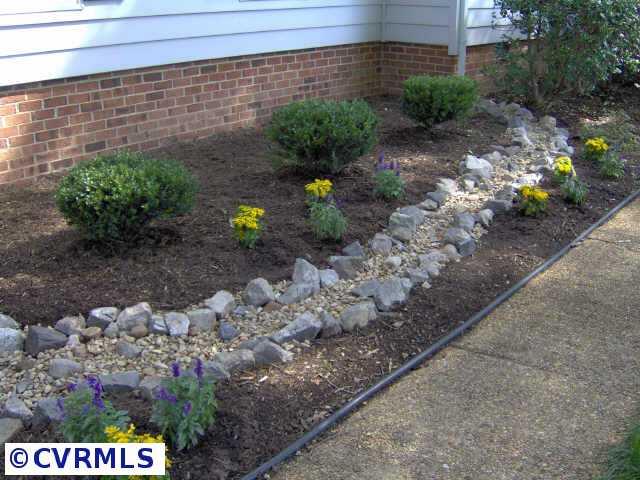 2612 Olde Stone Road Midlothian, VA 23113 - Photo 9 of 10 a view of a bunch of flowers and trees