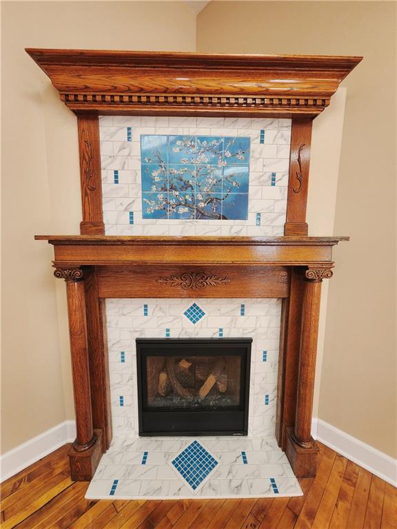 1750 Harbor Edinburg Road Edinburg, PA 16116 - Photo 11 of 39 a fireplace with a vase on top of it