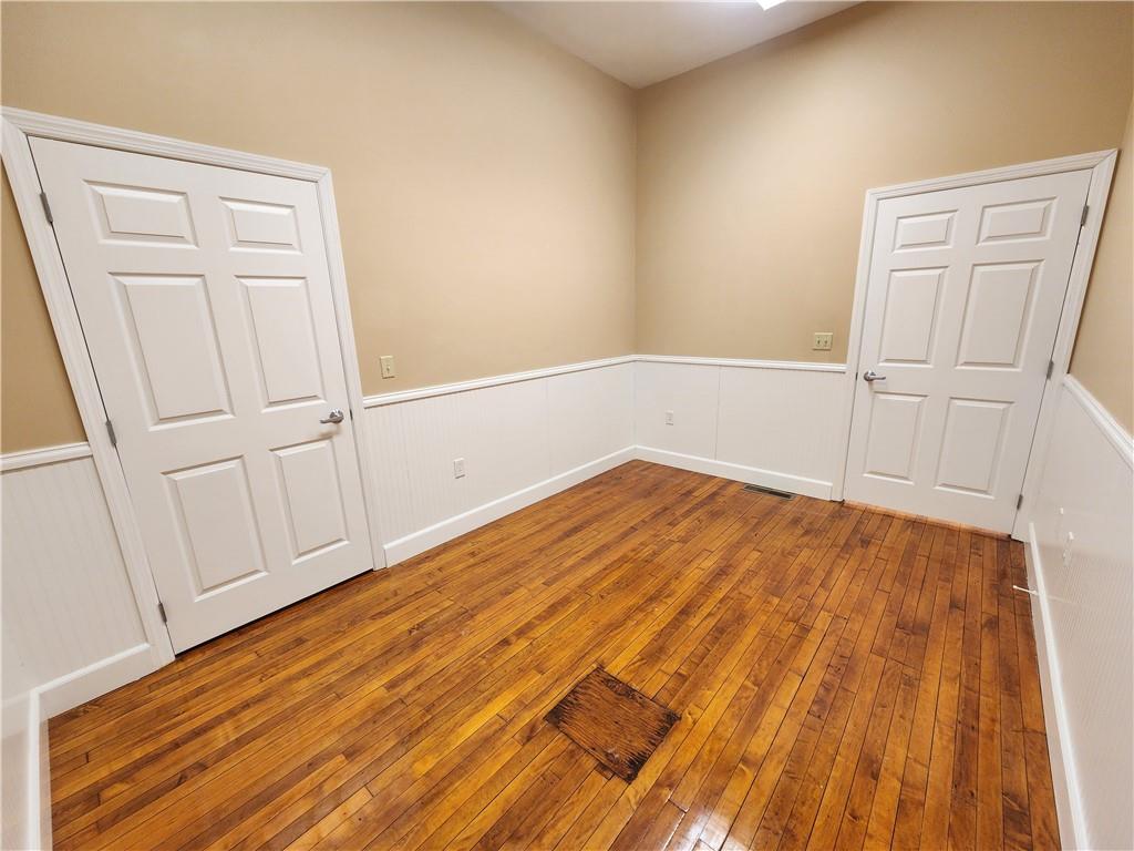 1750 Harbor Edinburg Road Edinburg, PA 16116 - Photo 17 of 39 a view of a room with wooden floor and white doors