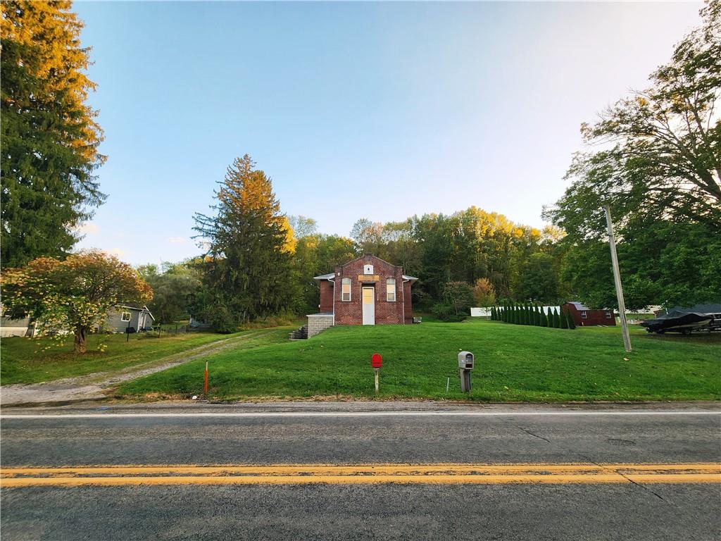 1750 Harbor Edinburg Road Edinburg, PA 16116 - Photo 2 of 39 a view of a yard in front of a house