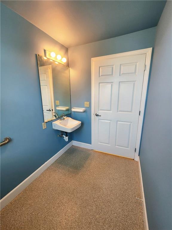 1750 Harbor Edinburg Road Edinburg, PA 16116 - Photo 24 of 39 a bathroom with a granite countertop sink and a mirror