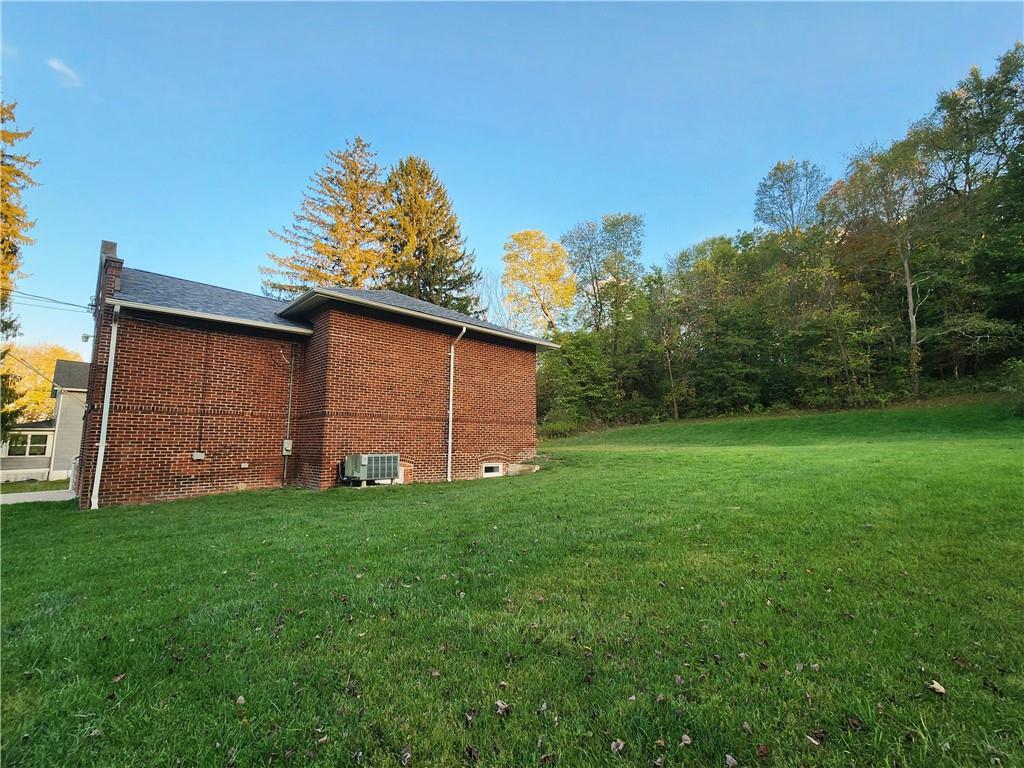 1750 Harbor Edinburg Road Edinburg, PA 16116 - Photo 35 of 39 a backyard of a house with lots of green space