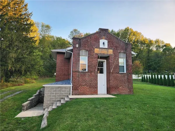 front view of a house with a yard