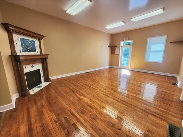 a fireplace with a vase on top of it