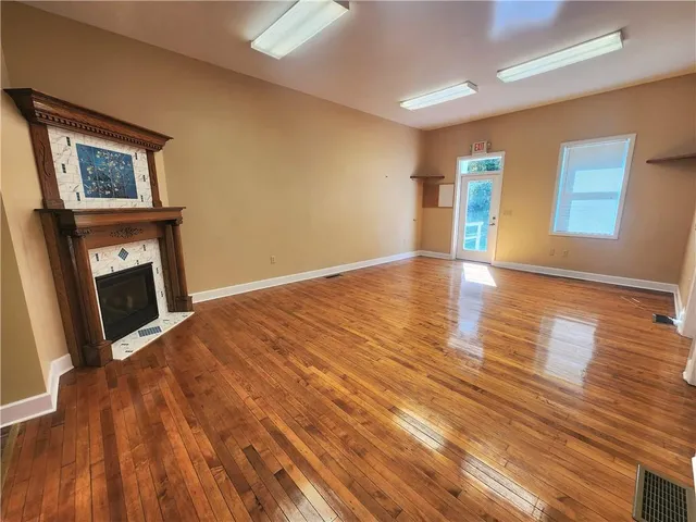 a fireplace with a vase on top of it