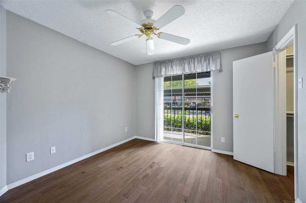 18333 Roehampton Drive, Unit 1412 Dallas, TX 75252 - Photo 12 of 14 wooden floor in an empty room with a window