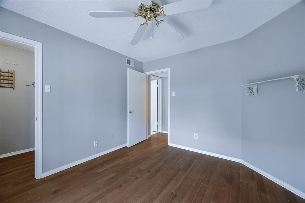 18333 Roehampton Drive, Unit 1412 Dallas, TX 75252 - Photo 13 of 14 wooden floor in an empty room with a window