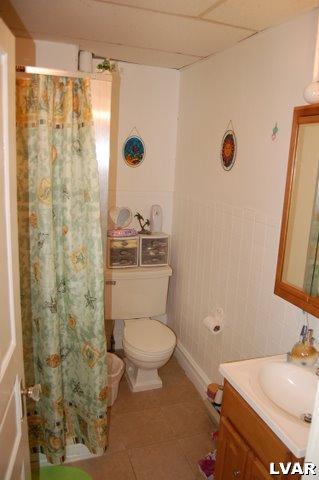 128 South 12th Street Allentown, PA 18102 - Photo 16 of 19 a bathroom with a sink a toilet and shower