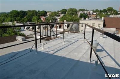 128 South 12th Street Allentown, PA 18102 - Photo 18 of 19 a view of a balcony with wooden floor and outdoor seating