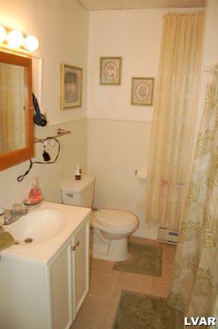 128 South 12th Street Allentown, PA 18102 - Photo 4 of 19 a bathroom with a sink a toilet and shower