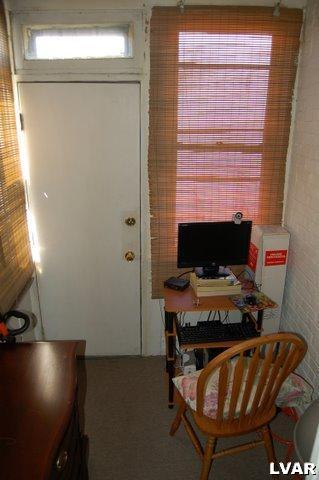 128 South 12th Street Allentown, PA 18102 - Photo 6 of 19 a workspace with furniture and lamp