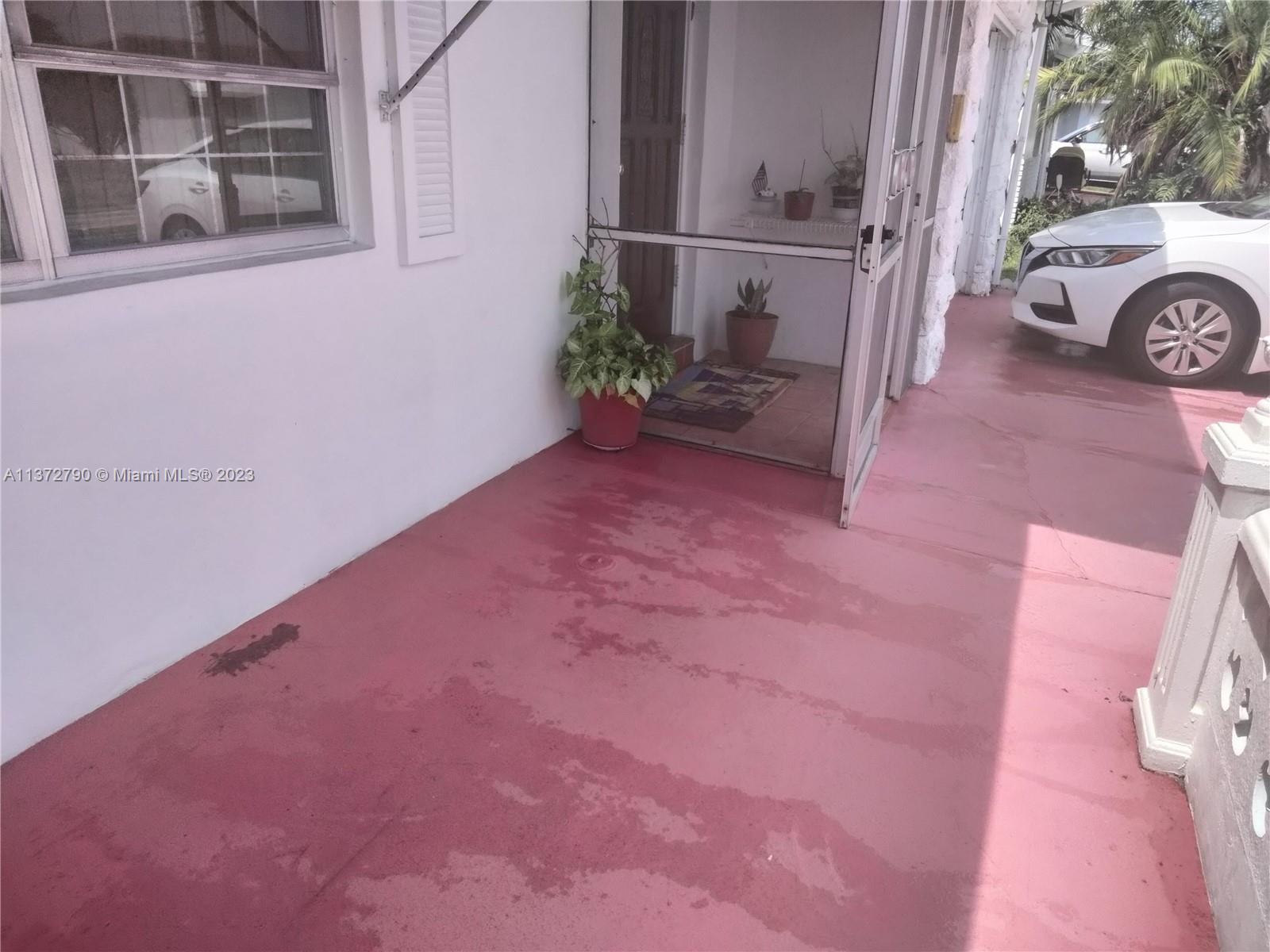 Paradise Gardens Margate, FL 33063 - Photo 11 of 12 a view of a house with a yard