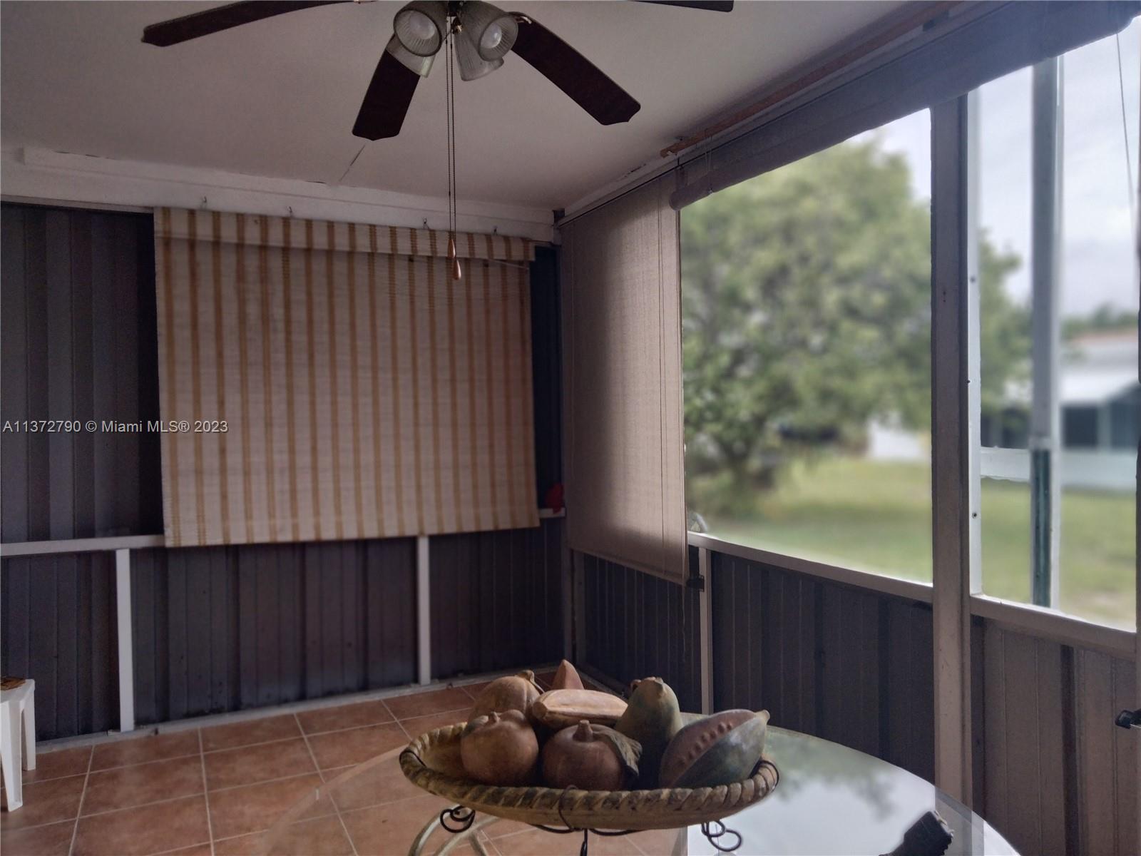 Paradise Gardens Margate, FL 33063 - Photo 2 of 12 a living room with a couch and a window