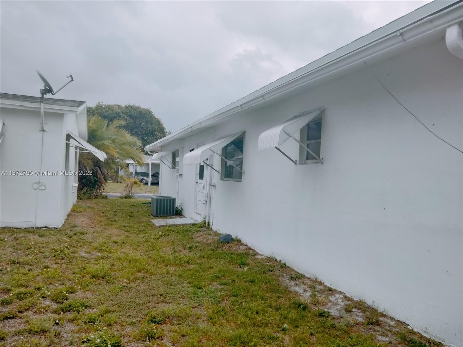 Paradise Gardens Margate, FL 33063 - Photo 9 of 12 a view of a backyard