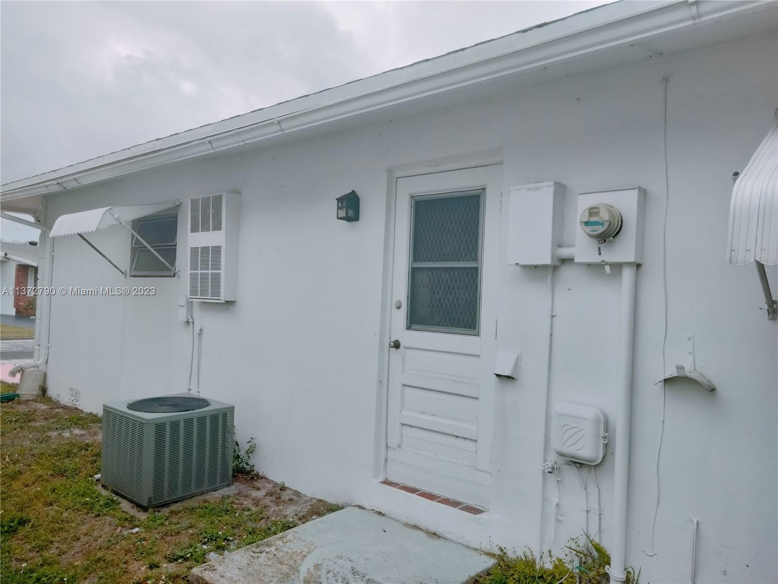 Paradise Gardens Margate, FL 33063 - Photo 10 of 12 a bathroom with a shower