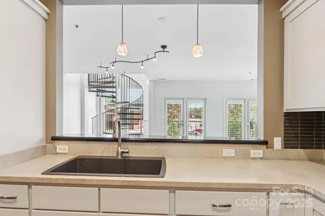 a kitchen with a sink and a window