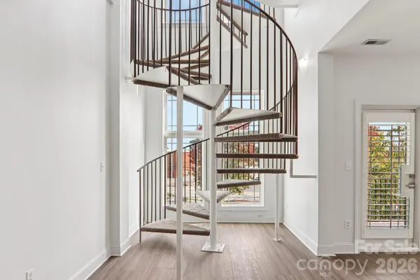 an entryway with wooden floor