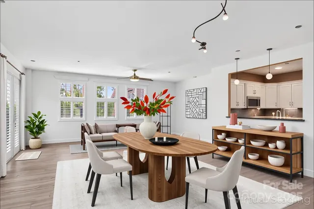 a view of a dining room with furniture kitchen and wooden floor