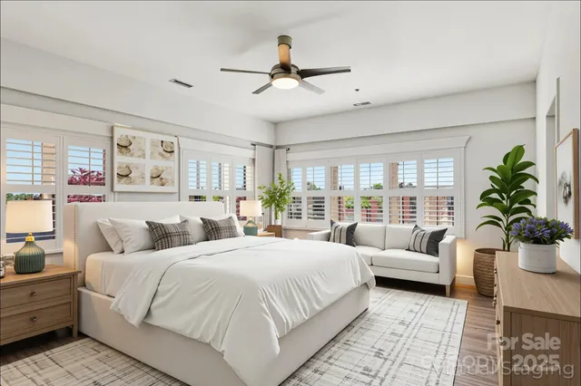 a bedroom with a large bed and a couch