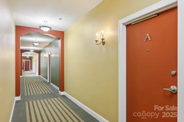 a view of a livingroom from a hallway