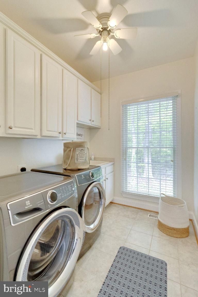 1602 Rabbit Foot Clover Court Annapolis, MD 21401 - Photo 33 of 59 Tiled Laundry with Storage Cabinetry