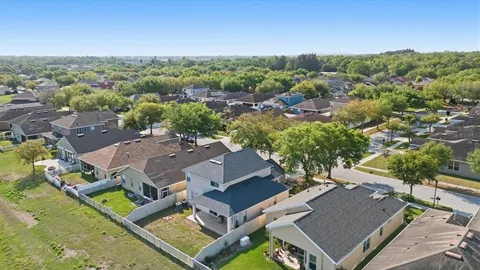 an aerial view of a house with a mountain view