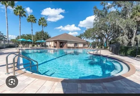 a view of a house with swimming pool