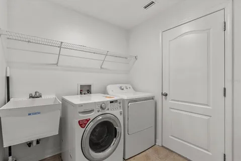 a utility room with dryer and washer