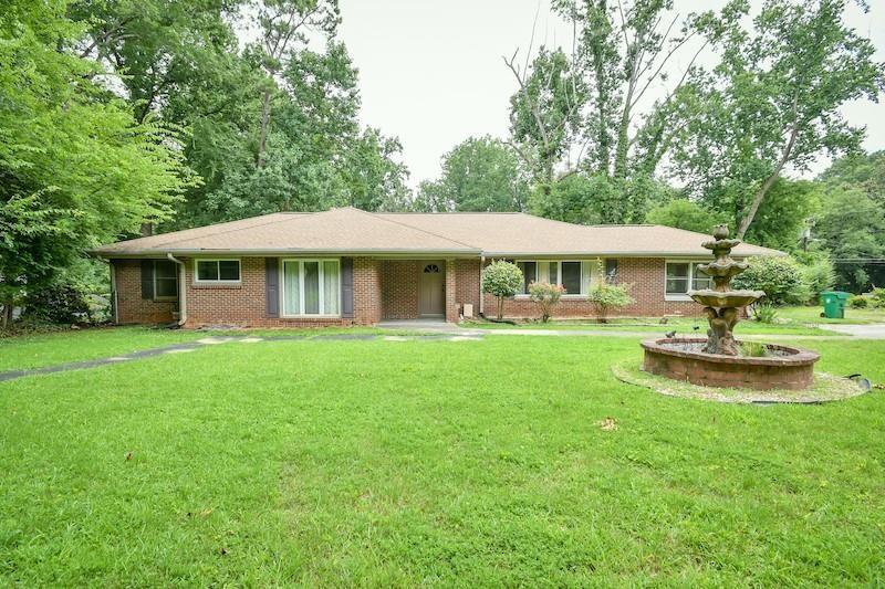 a view of a house with swimming pool and porch with furniture