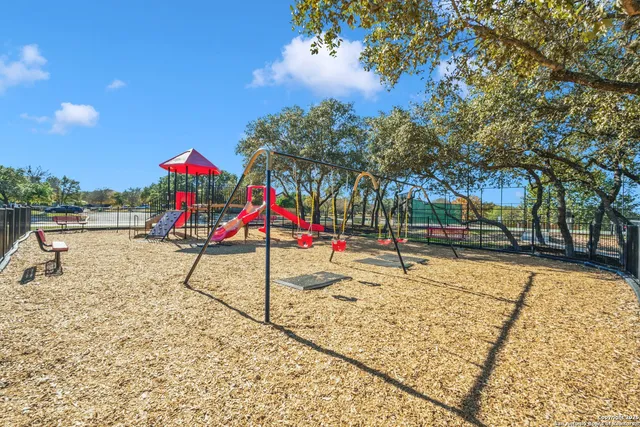 a view of a swimming pool with a yard