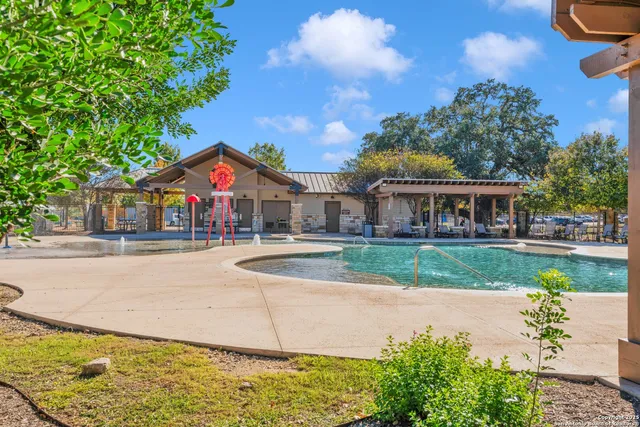 a view of a livingroom with workspace and a window