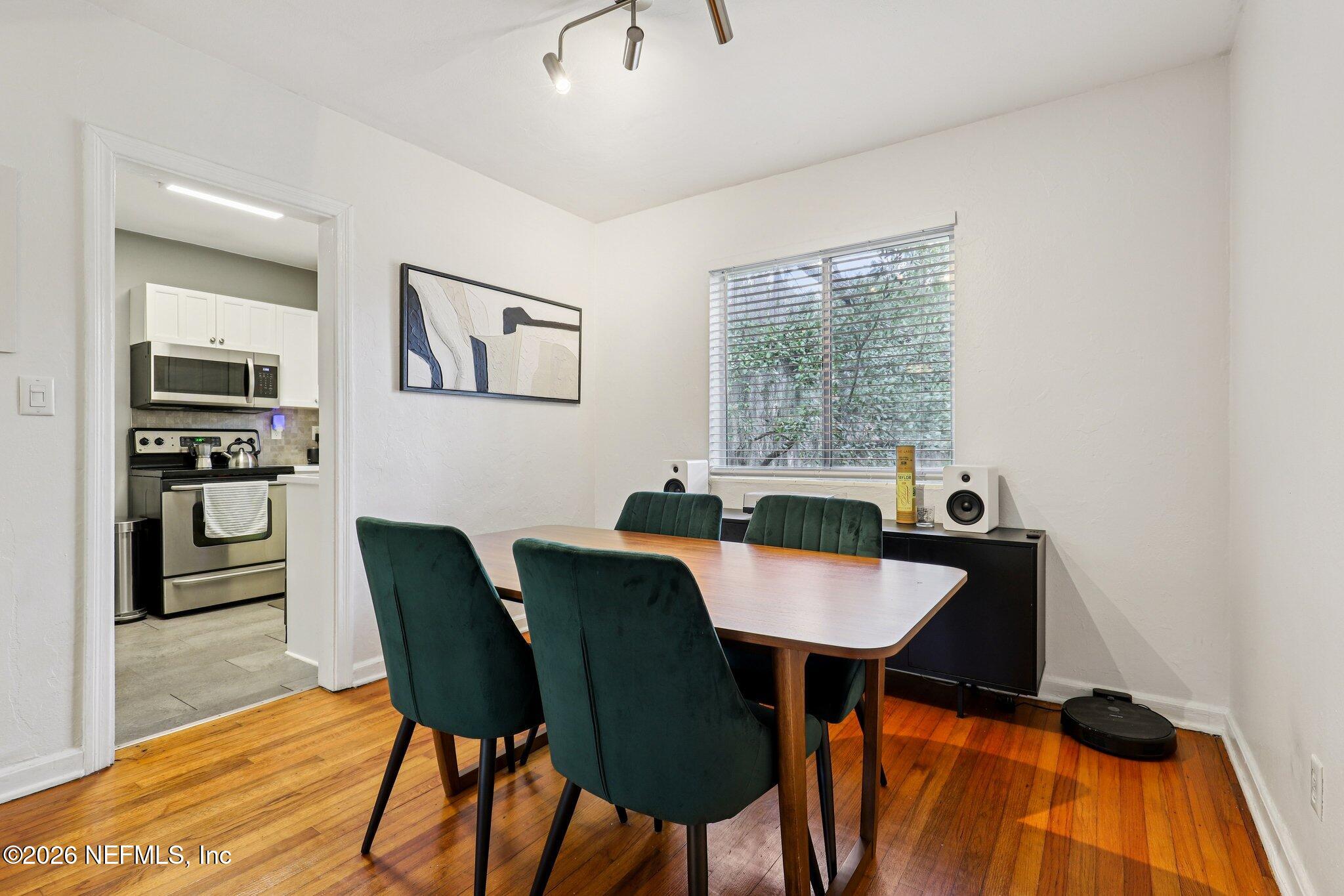2159 Riverside Avenue, Unit 4 Jacksonville, FL 32204 - Photo 12 of 50 a view of a dining room with furniture and wooden floor